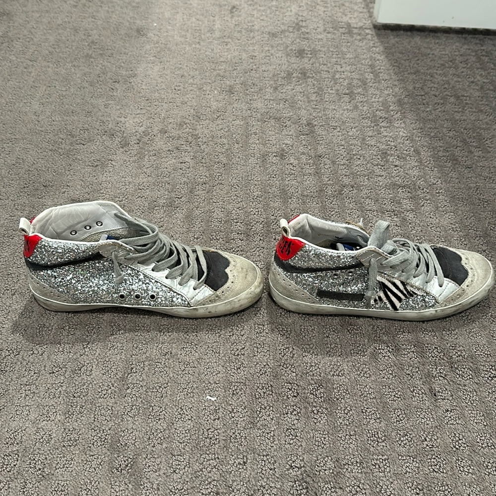 Golden Goose mid-top sneakers with glitter, leather, and seude.
